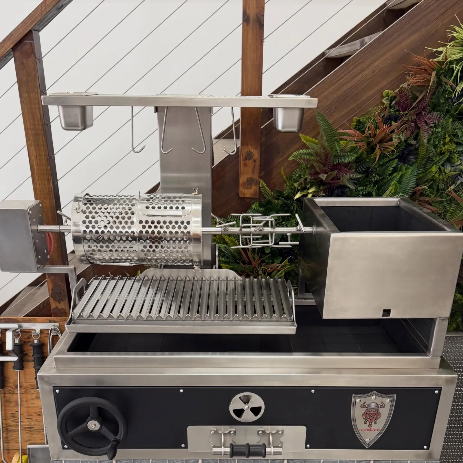 Bottom wheel Argentinian grill with rotisserie basket and side firebox