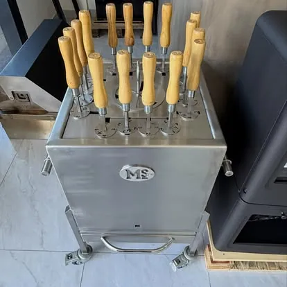 Skewer cabinet: Stainless cabinet with timber-handled skewers.