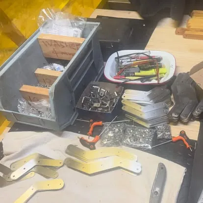 In the workshop: Hardware and hinges, ready for assembly.